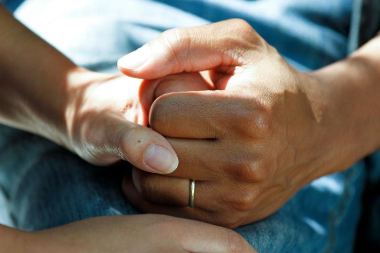 Two people holding hands.