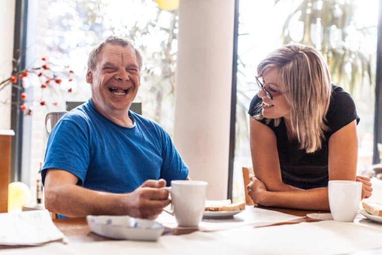 Smiling man with lady practitioner