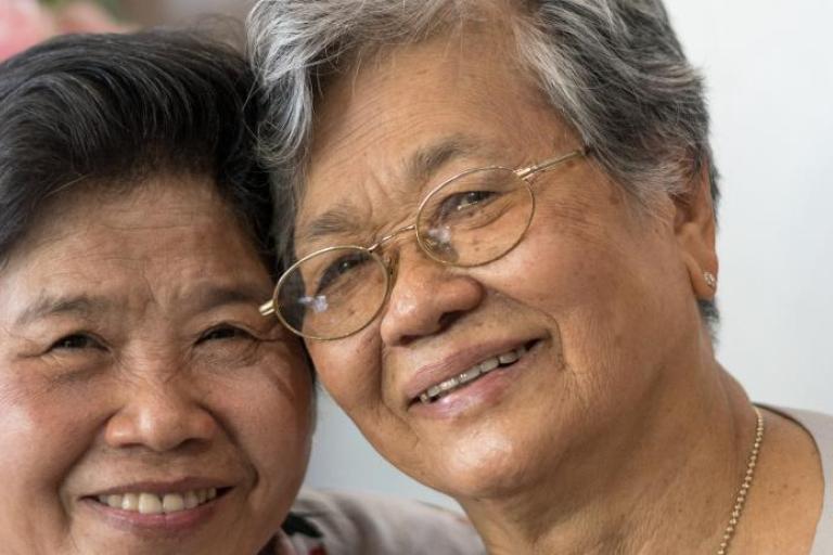 A women hugging her elderly mother.